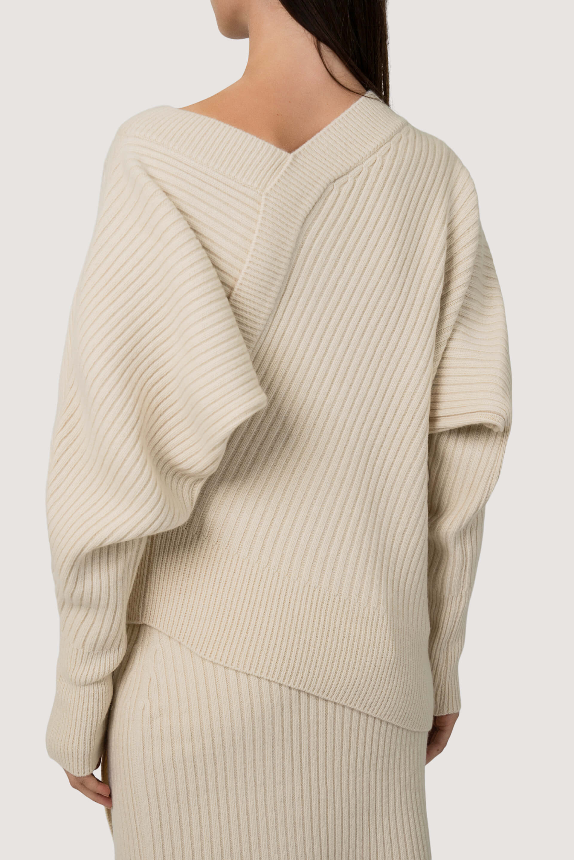 Asymetric sculptural rib knit sweater